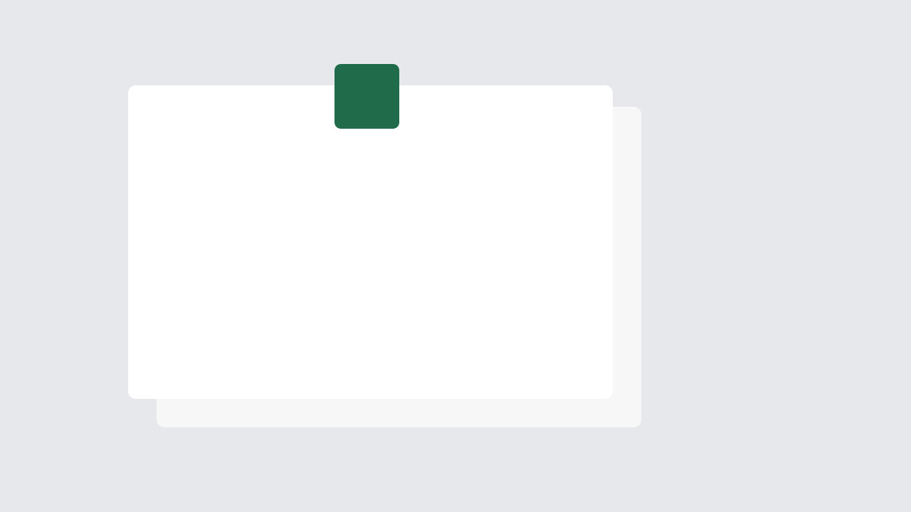 A stack of white sheets held by a green clip
